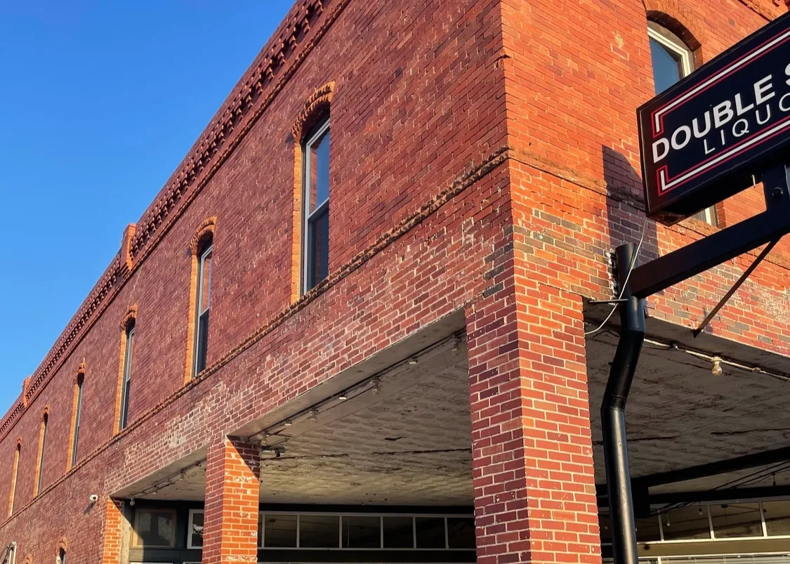 The restored brick building that contains Stoplight Lofts